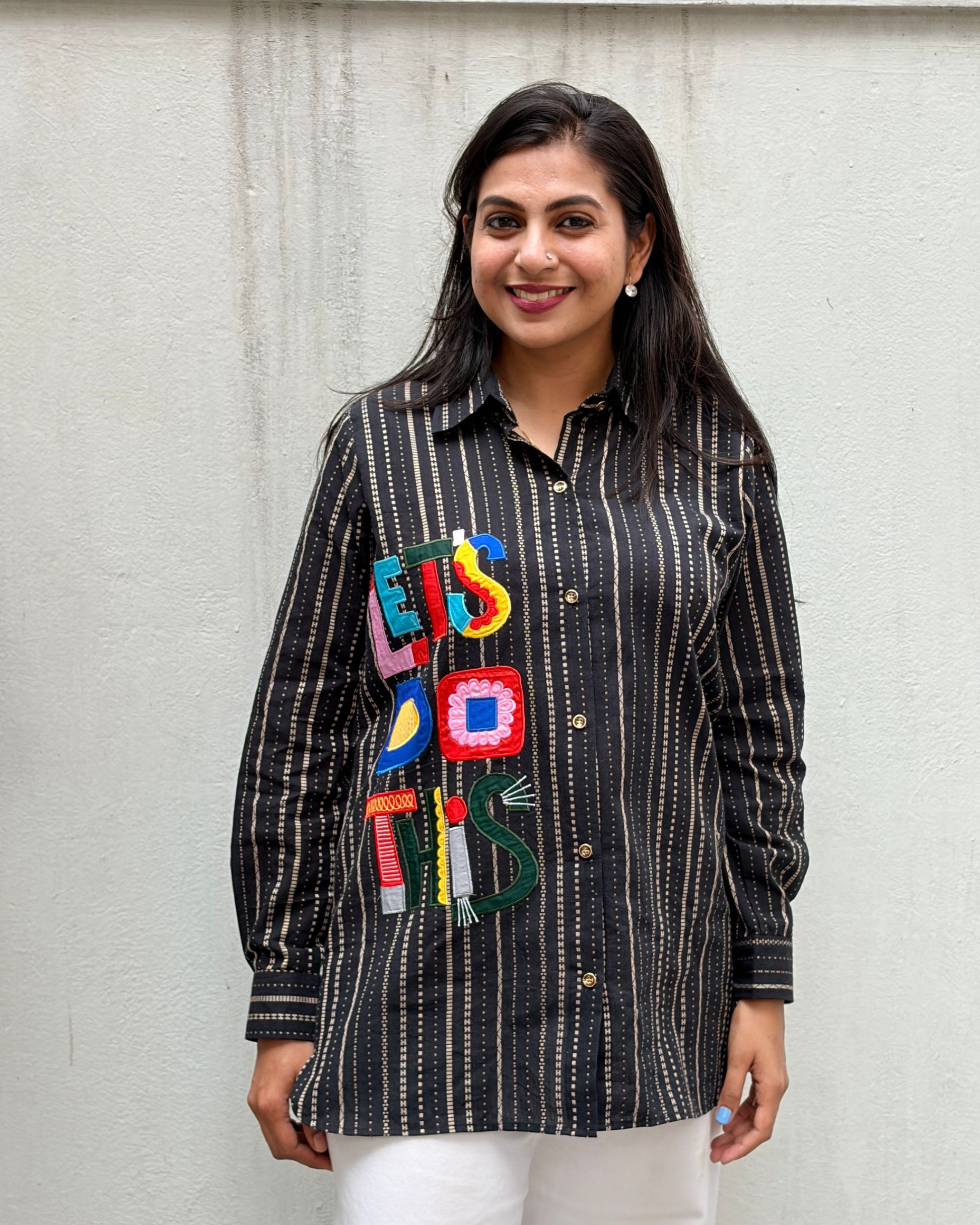 black shirt with colourful applique