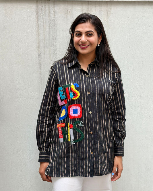 black shirt with colourful applique
