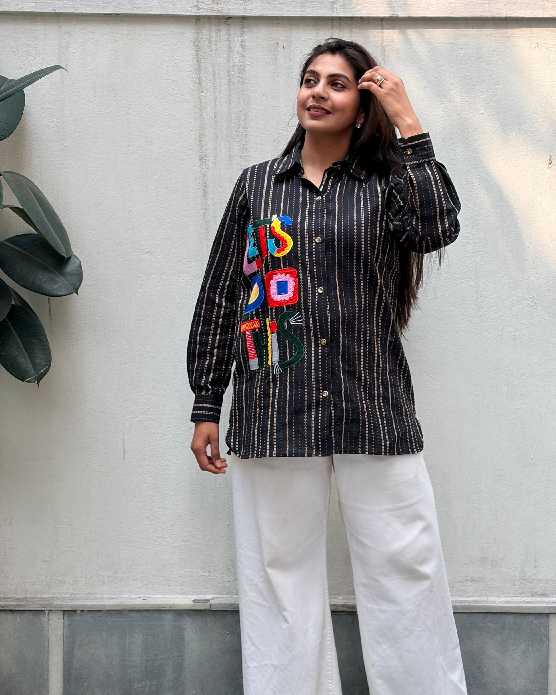 black shirt with colourful applique