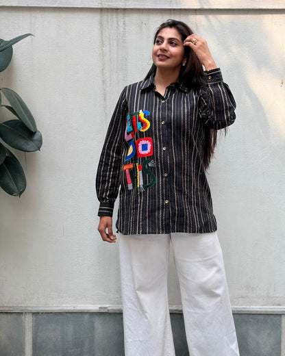 black shirt with colourful applique