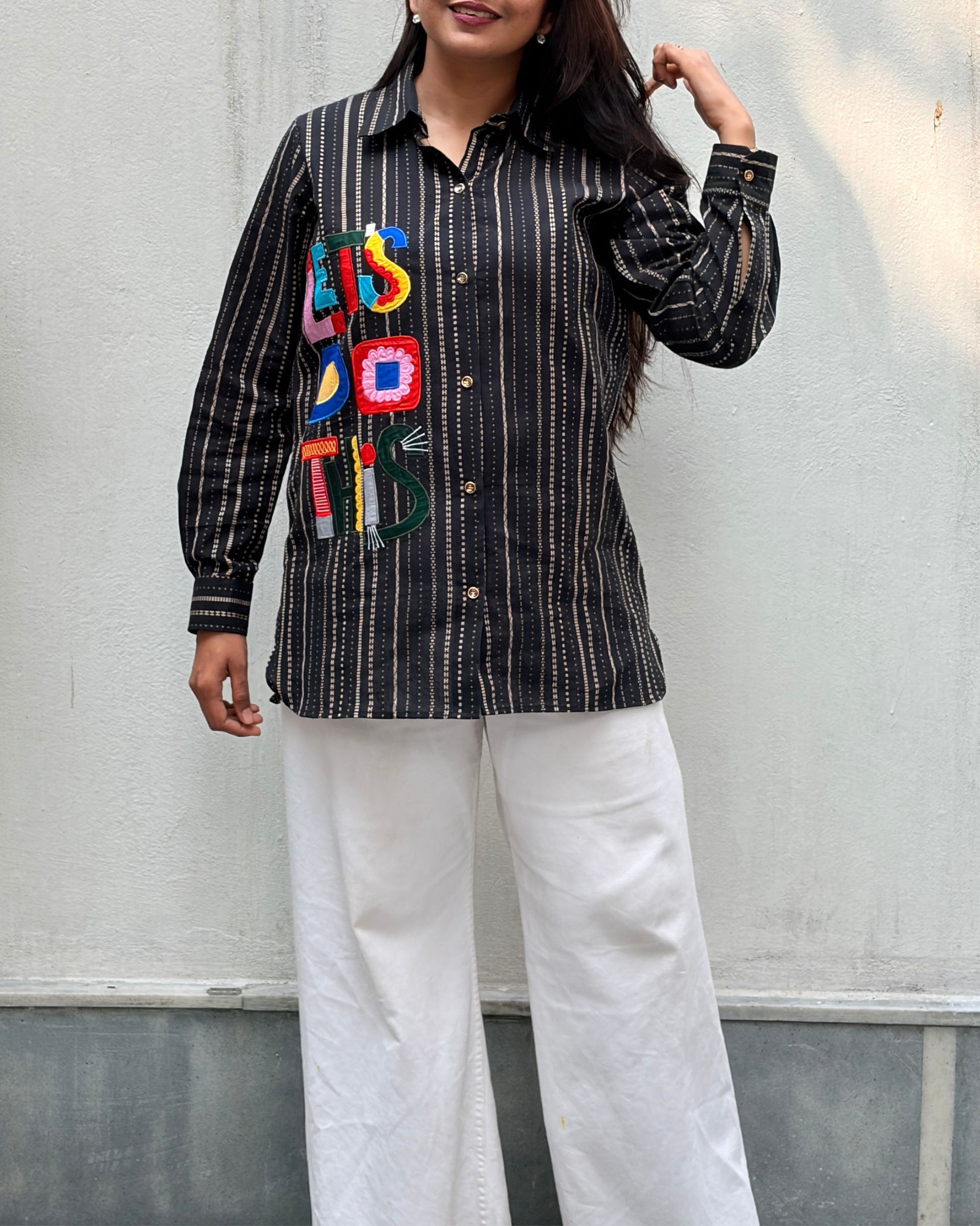 black shirt with colourful applique