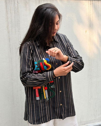black shirt with colourful applique