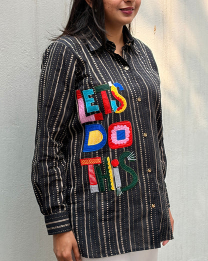 black shirt with colourful applique